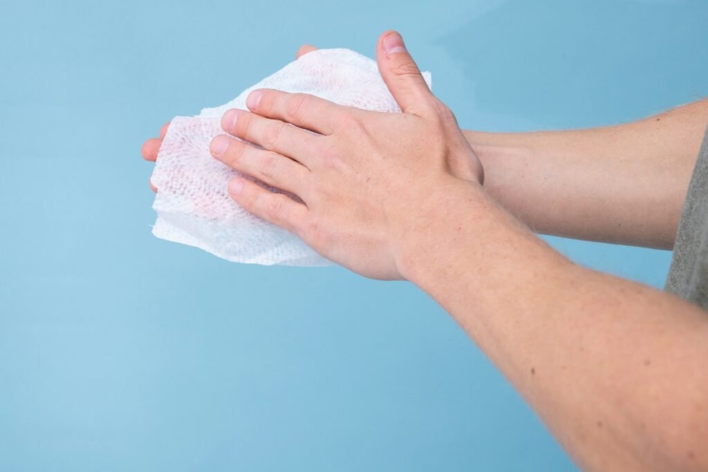 person holding white tissue paper
